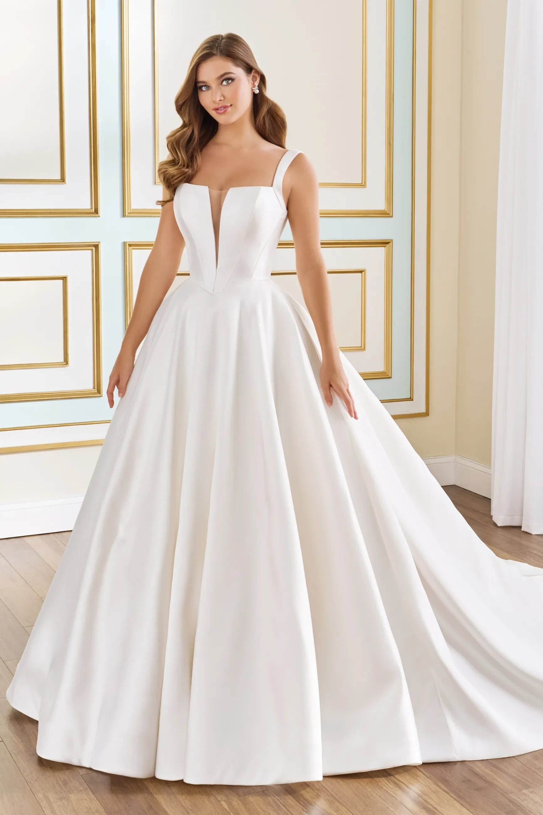 Model wearing a white Off the Shoulder Gown