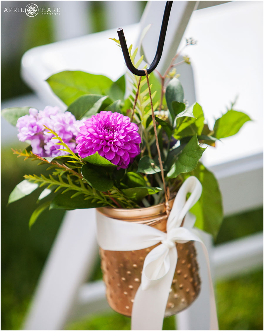 Pretty-Purple-Aisle-Decor-in-a-Gold-Painted-Jar-from-Painted-Primrose-Boulder-Colorado-Florist.jpg